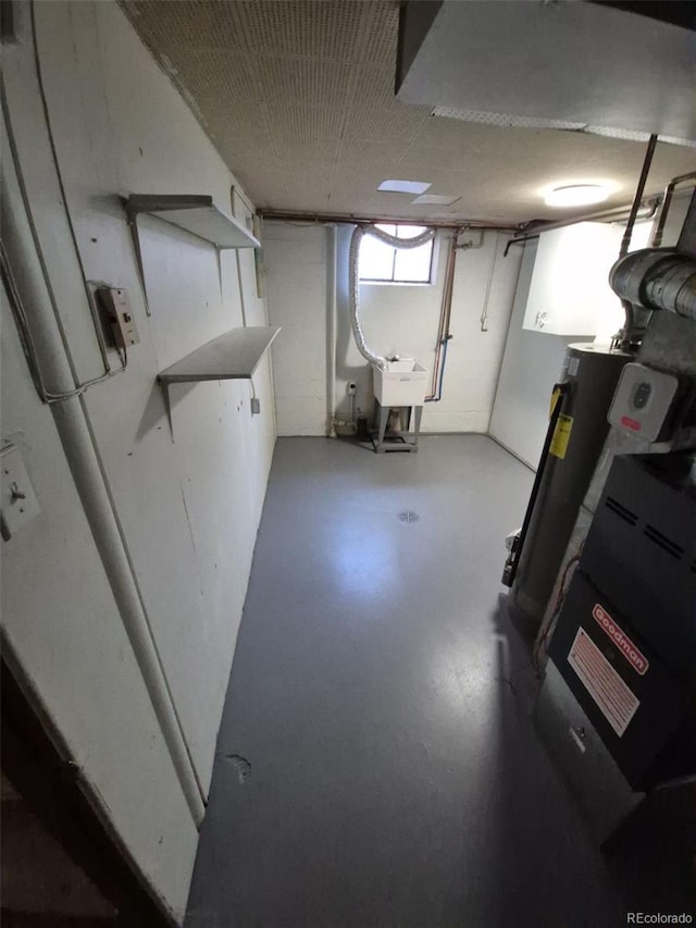 588 Empire St, Aurora, CO 80010 - below grade area with gas water heater and a sink