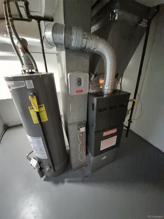 588 Empire St, Aurora, CO 80010 - utility room featuring water heater