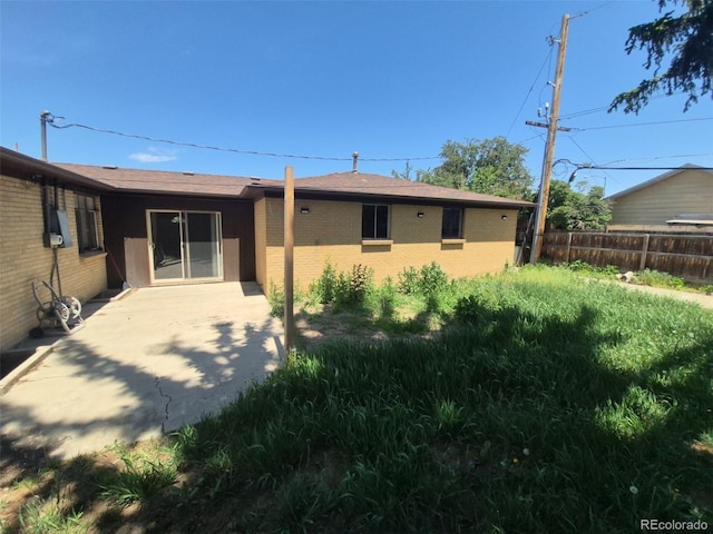 588 Empire St, Aurora, CO 80010 - back of house with a patio and brick siding