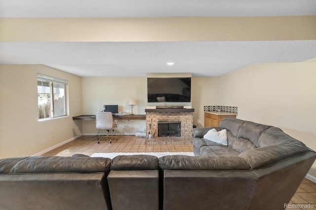 6856 S Broadway, Centennial, CO 80122 - living room featuring baseboards, tile patterned flooring, and a brick fireplace