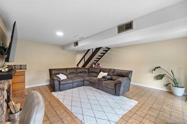 6856 S Broadway, Centennial, CO 80122 - living area featuring light tile patterned floors, stairway, baseboards, a textured ceiling, and recessed lighting