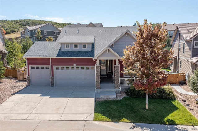 view of front of house with a front lawn and a garage