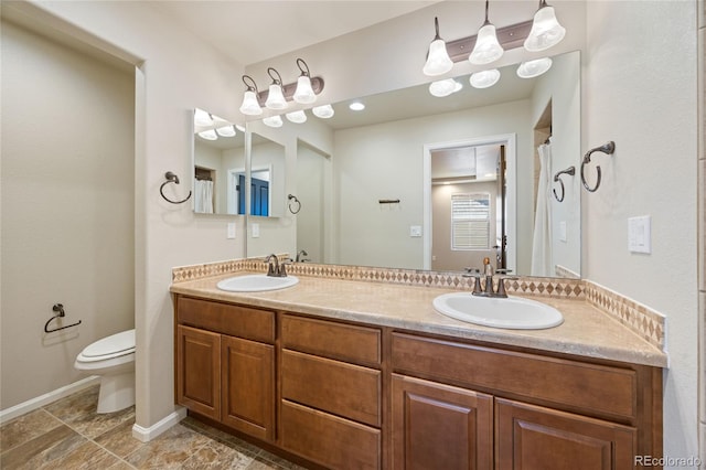 bathroom with vanity and toilet