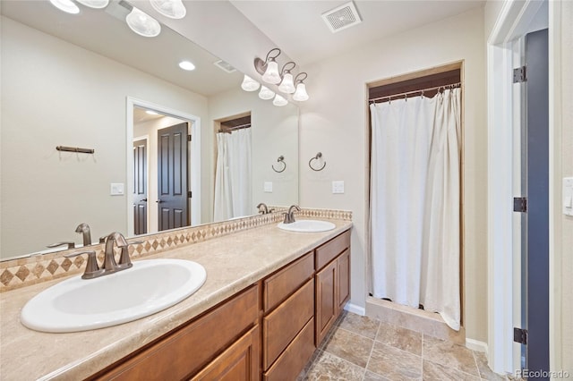 bathroom with vanity and curtained shower