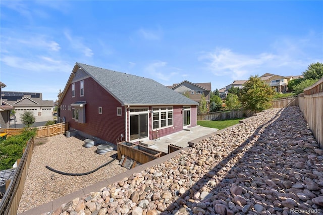 rear view of property with a patio area