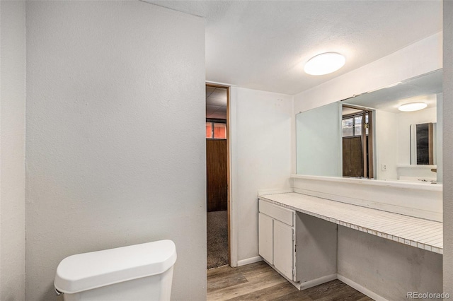 12058 E Virginia Pl, Aurora, CO 80012 - half bath featuring wood finished floors and vanity