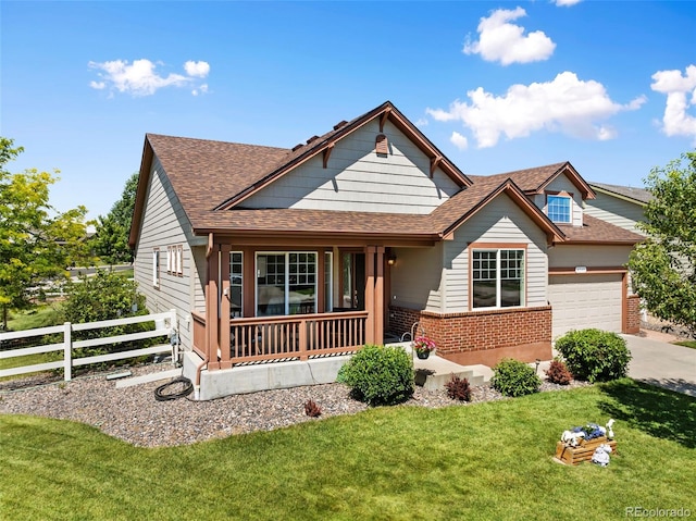 4143 Eagle Ridge Way, Castle Rock, CO 80104 - view of front of property with brick siding, covered porch, driveway, roof with shingles, and an attached garage