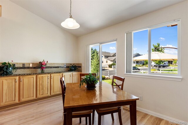 4143 Eagle Ridge Way, Castle Rock, CO 80104 - dining area with light wood-style floors and lofted ceiling