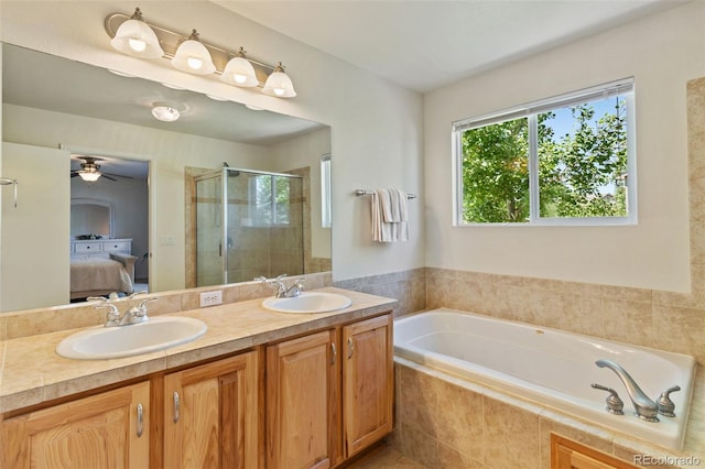 4143 Eagle Ridge Way, Castle Rock, CO 80104 - full bathroom with ensuite bathroom, a shower stall, a garden tub, double vanity, and ceiling fan