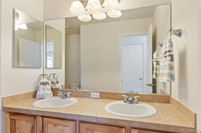 4143 Eagle Ridge Way, Castle Rock, CO 80104 - bathroom featuring double vanity and toilet