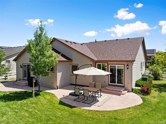 4143 Eagle Ridge Way, Castle Rock, CO 80104 - back of property with entry steps, a shingled roof, a patio area, and a yard