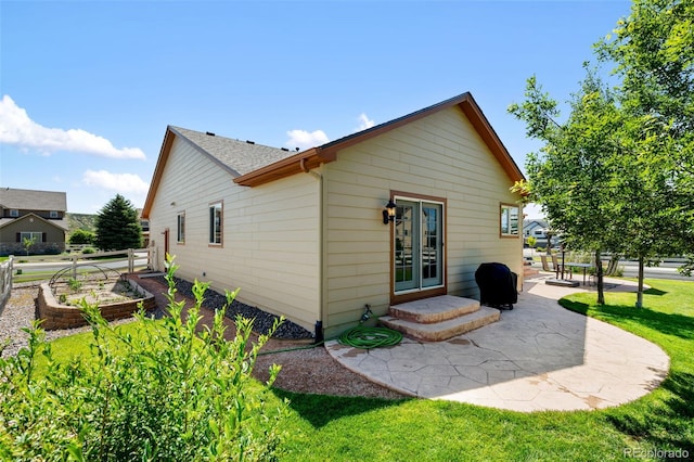 4143 Eagle Ridge Way, Castle Rock, CO 80104 - rear view of house featuring a patio area, a yard, and french doors