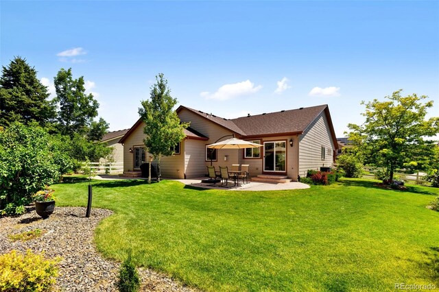 4143 Eagle Ridge Way, Castle Rock, CO 80104 - back of property featuring entry steps, a patio area, and a yard