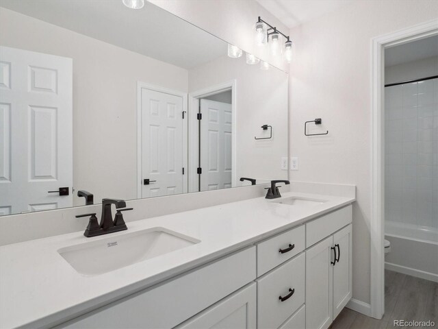 4741 Twelve Oaks Way, Castle Rock, CO 80104 - bathroom featuring double vanity, toilet, and bathing tub / shower combination