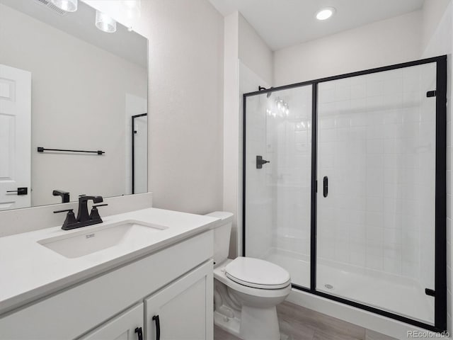 4741 Twelve Oaks Way, Castle Rock, CO 80104 - full bath featuring a stall shower, toilet, vanity, wood finished floors, and recessed lighting