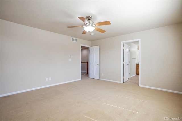 unfurnished bedroom featuring visible vents, light colored carpet, baseboards, and ceiling fan