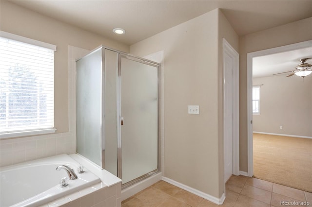 full bath featuring tile patterned flooring, a shower stall, a ceiling fan, and a garden tub