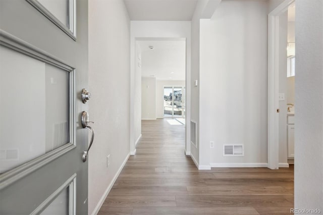 corridor featuring light wood-type flooring