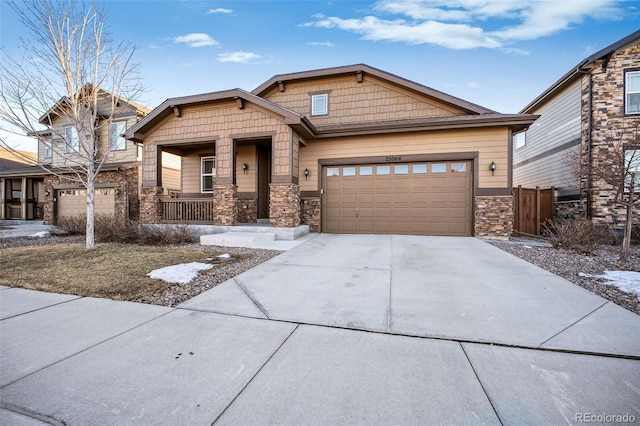 craftsman-style house featuring a garage and covered porch