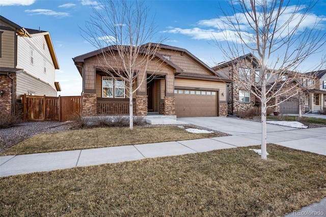 craftsman-style home featuring a garage and a front lawn