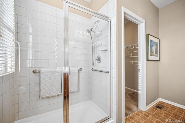 bathroom featuring an enclosed shower