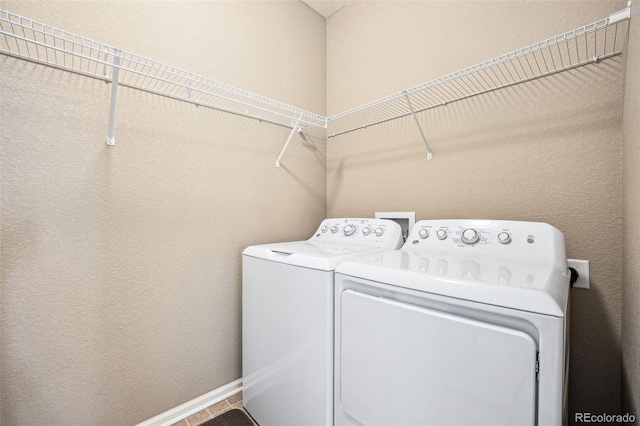 laundry area with separate washer and dryer