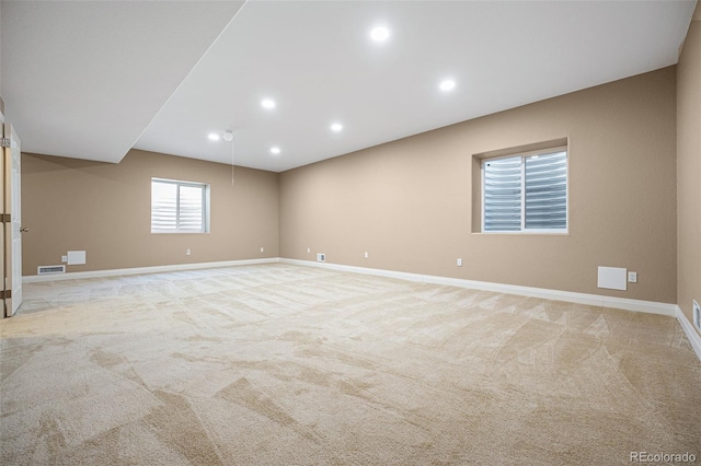 spare room with light colored carpet