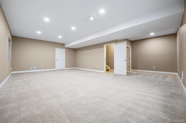 basement with light colored carpet