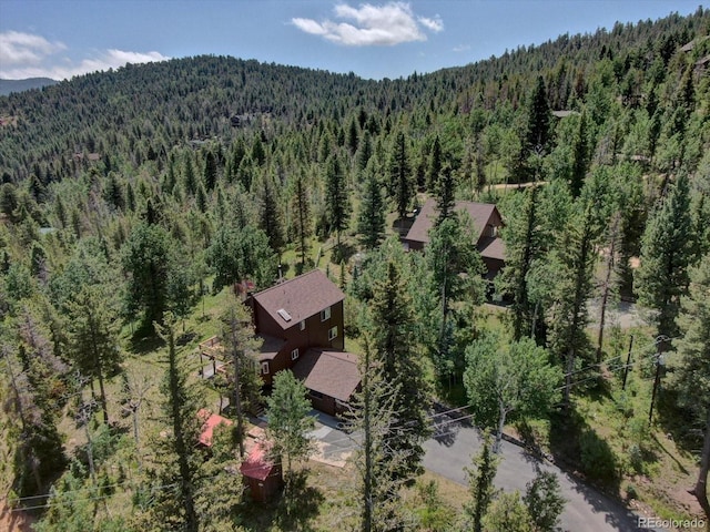 10438 Sunlight Ln, Conifer, CO 80433 - view of subject property featuring a heavily wooded area and mountains