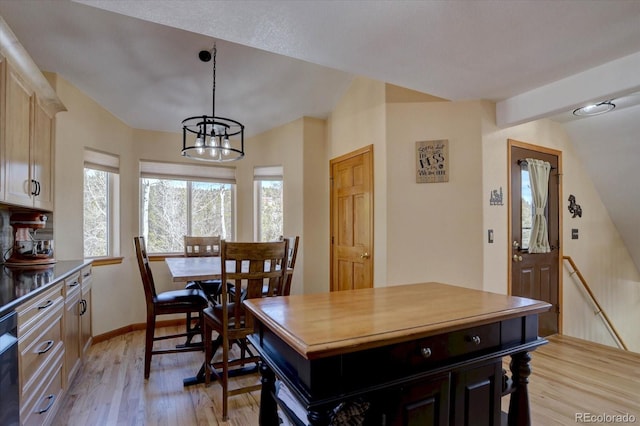 10438 Sunlight Ln, Conifer, CO 80433 - dining space featuring a chandelier, plenty of natural light, and light wood-style floors