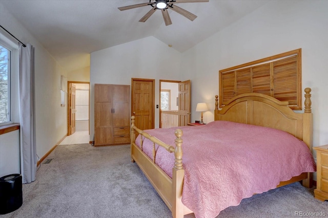 10438 Sunlight Ln, Conifer, CO 80433 - bedroom featuring multiple windows, carpet, ceiling fan, high vaulted ceiling, and connected bathroom