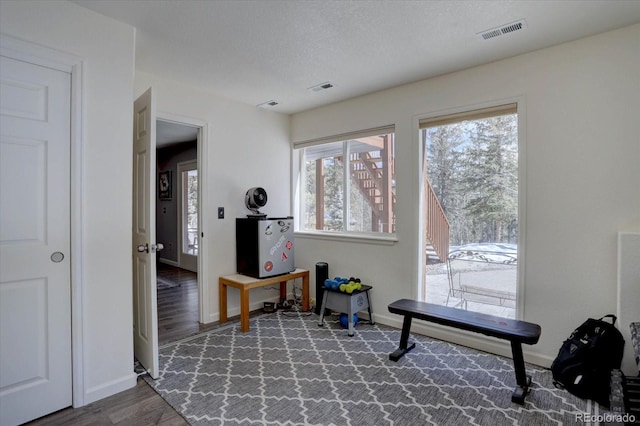 10438 Sunlight Ln, Conifer, CO 80433 - workout area with baseboards and wood finished floors