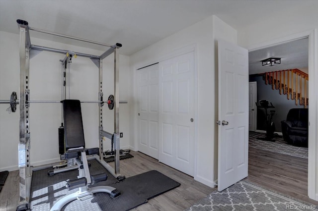 10438 Sunlight Ln, Conifer, CO 80433 - exercise room featuring wood finished floors and baseboards