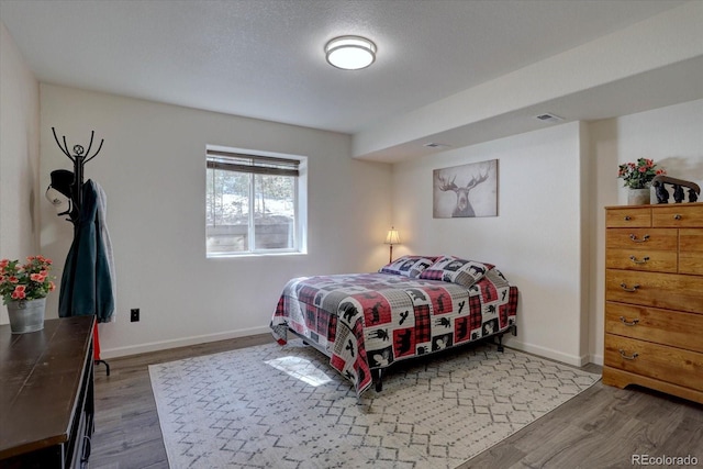 10438 Sunlight Ln, Conifer, CO 80433 - bedroom featuring wood finished floors