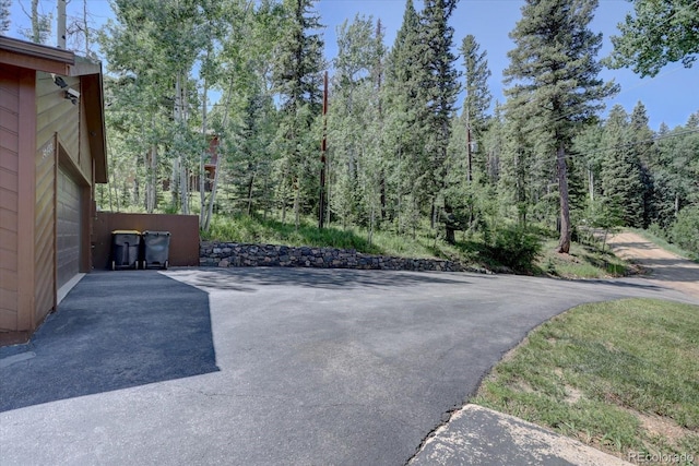 10438 Sunlight Ln, Conifer, CO 80433 - view of patio / terrace with a wooded view