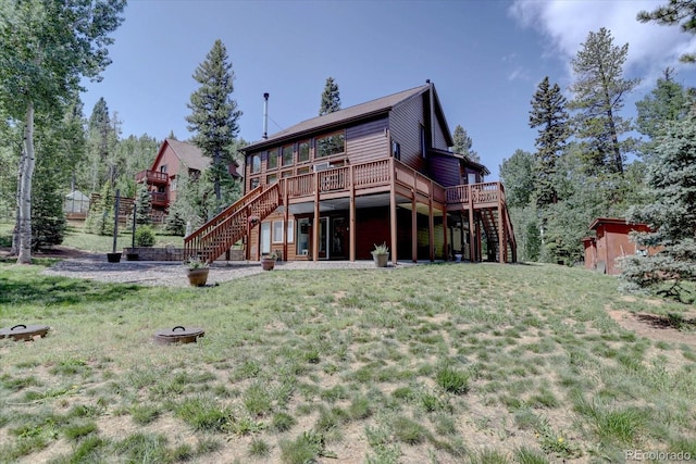 10438 Sunlight Ln, Conifer, CO 80433 - rear view of property with stairway, a wooden deck, and a yard