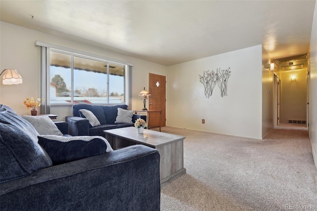 carpeted living area with visible vents