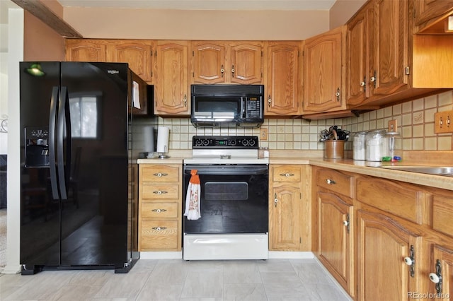 kitchen with backsplash, black appliances, and light countertops