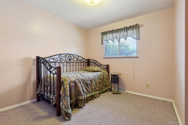 carpeted bedroom featuring visible vents and baseboards