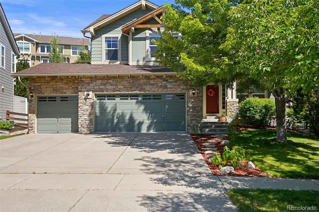 craftsman-style home with a garage and a front lawn