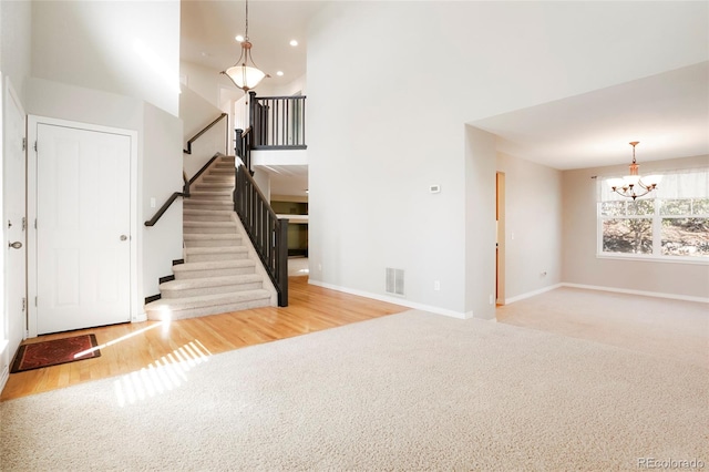 interior space with a notable chandelier and light wood-type flooring