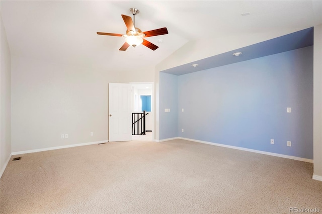 interior space with carpet floors, ceiling fan, and lofted ceiling