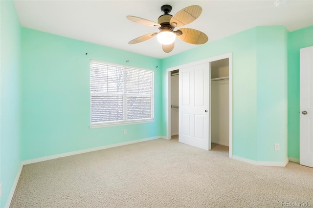 unfurnished bedroom with a closet, ceiling fan, and light colored carpet