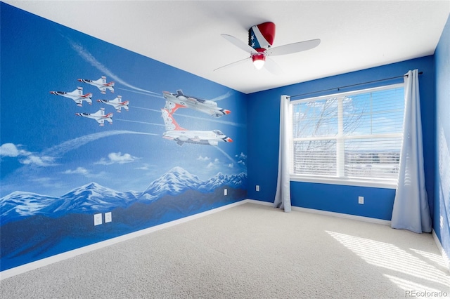 empty room featuring carpet flooring and ceiling fan