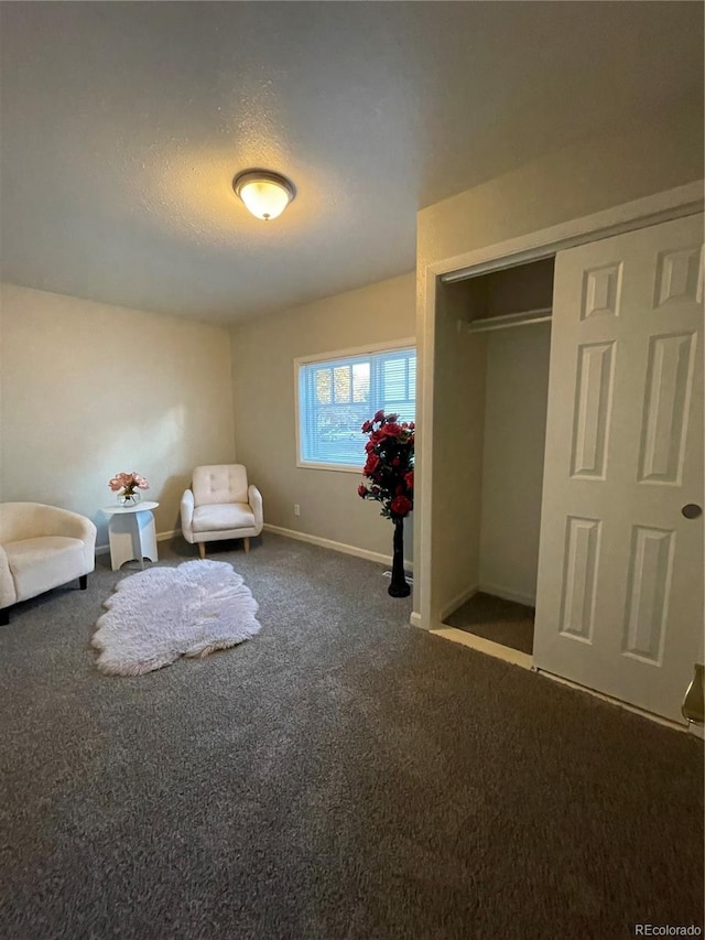 unfurnished room with carpet floors and a textured ceiling