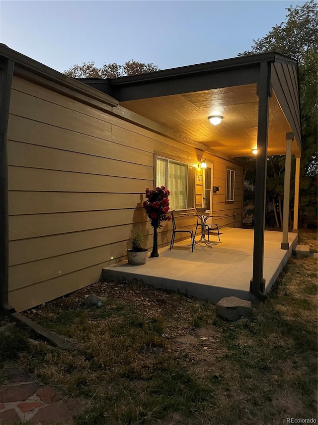 view of patio terrace at dusk