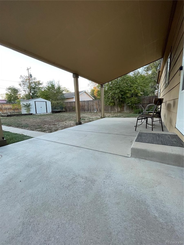 view of patio with a storage unit