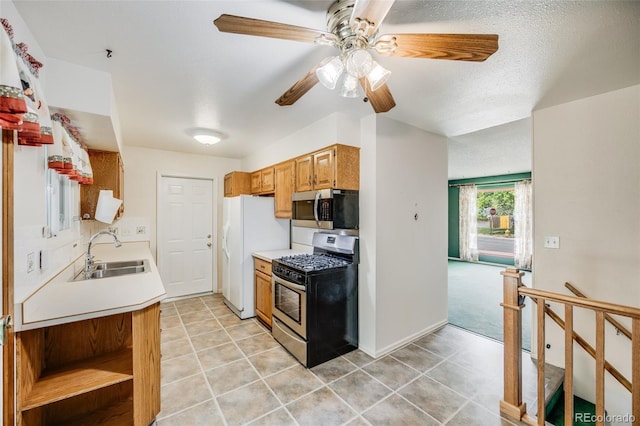 4511 S Braun Ct, Morrison, CO 80465 - kitchen featuring stainless steel appliances, light countertops, ceiling fan, and light tile patterned flooring