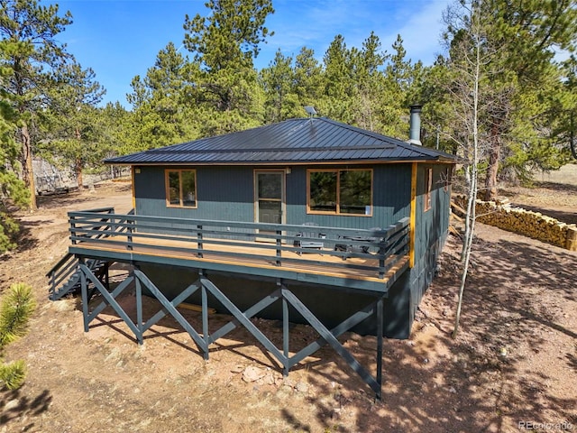 29 Deerfield Ln, Florissant, CO 80816 - view of front of property featuring a wooden deck and metal roof