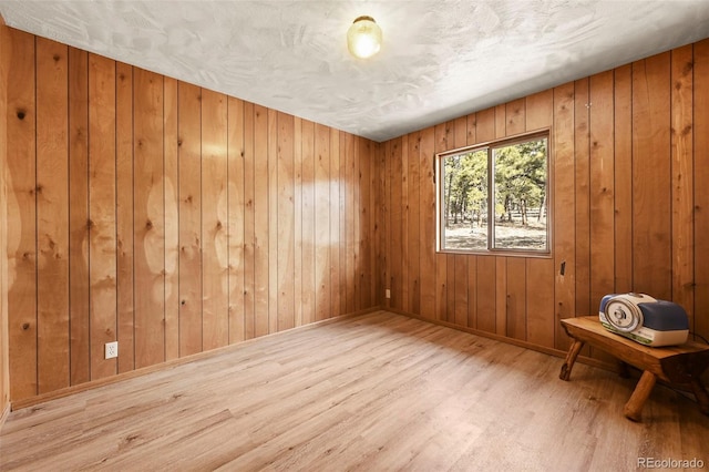 29 Deerfield Ln, Florissant, CO 80816 - empty room with wood finished floors, wooden walls, and baseboards